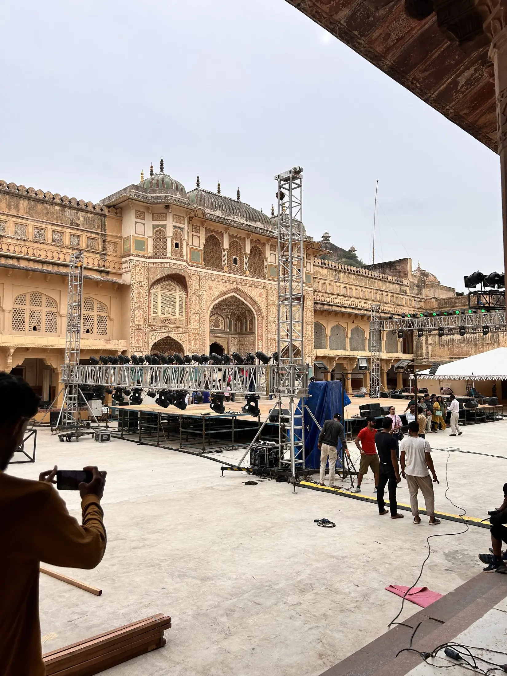 Stage and lighting being set up in the courtyard of Amer Fort, Jaipur