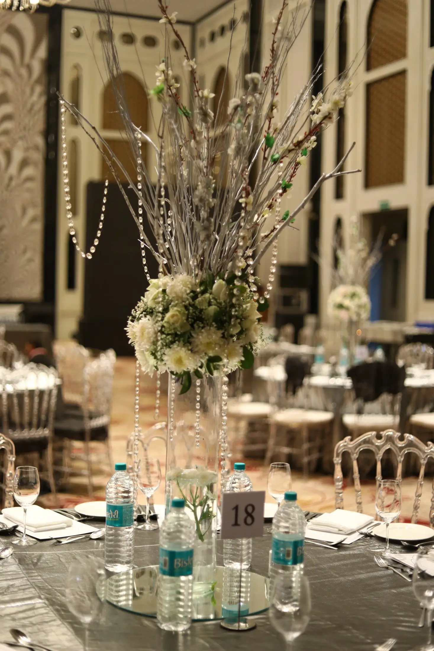 Floral centrepiece on a dinner table at a wedding reception