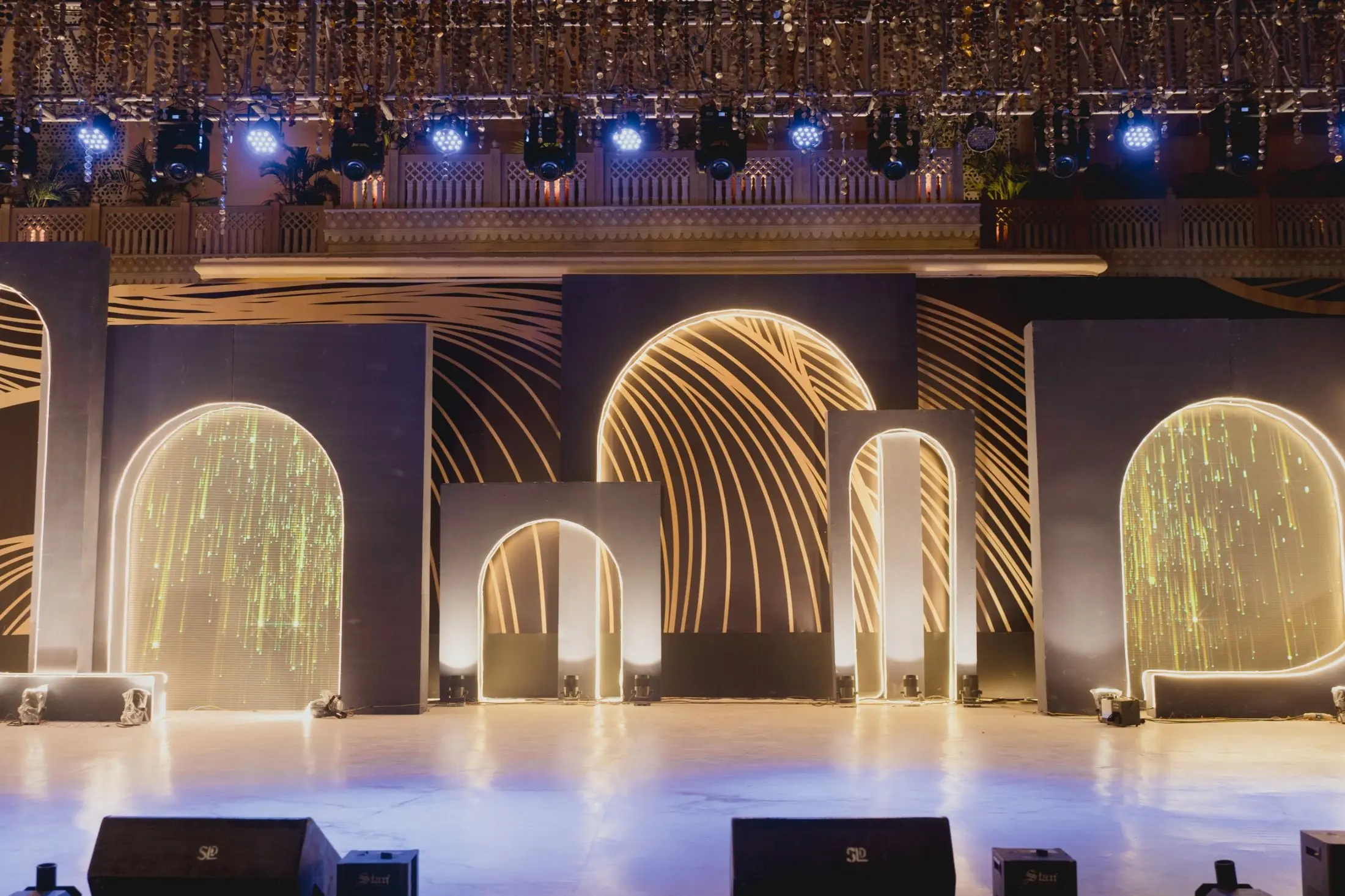 Illuminated arched stage set for an evening performance